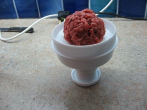 Making the burger in a burger press